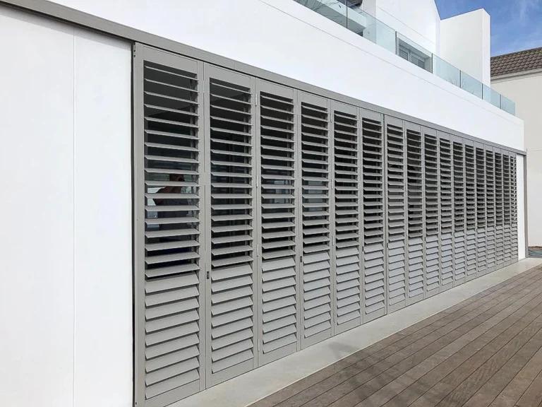 Exterior shutters along a coastal deck
