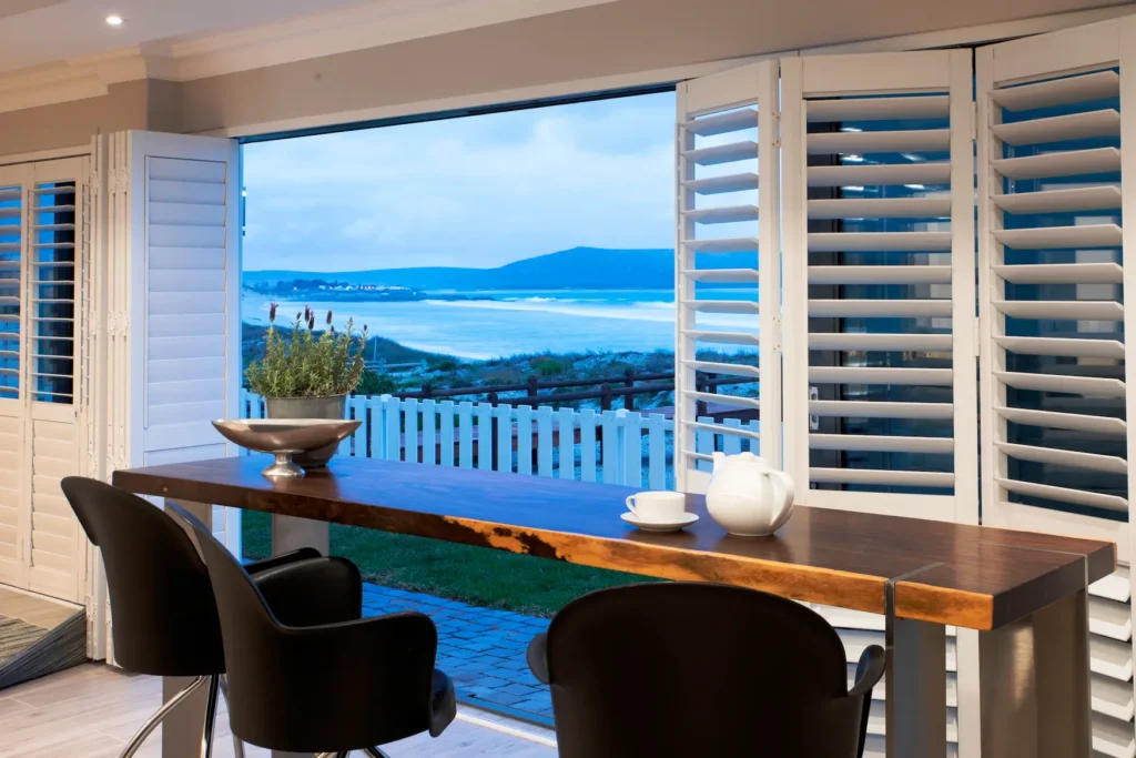 Shutters folded open to a sea view in a Ballito home