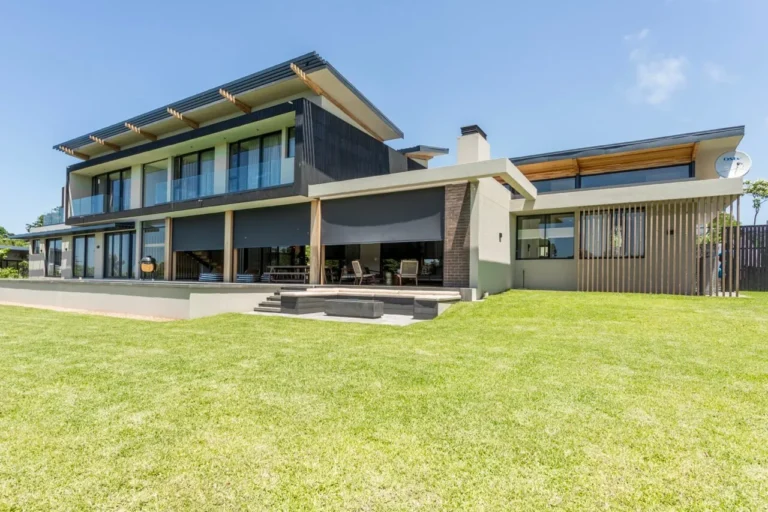 Custom curtains fitted in a Ballito home Motorised outdoor screen blinds on a Dolphin Coast home