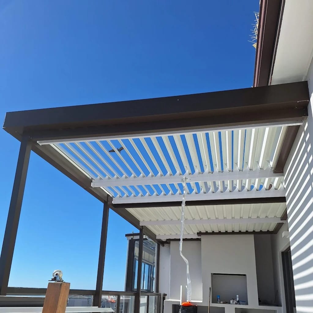 fixed-louvre-awning Fixed louvre awning providing patio shade in a Zululami Luxury Estate in South African home