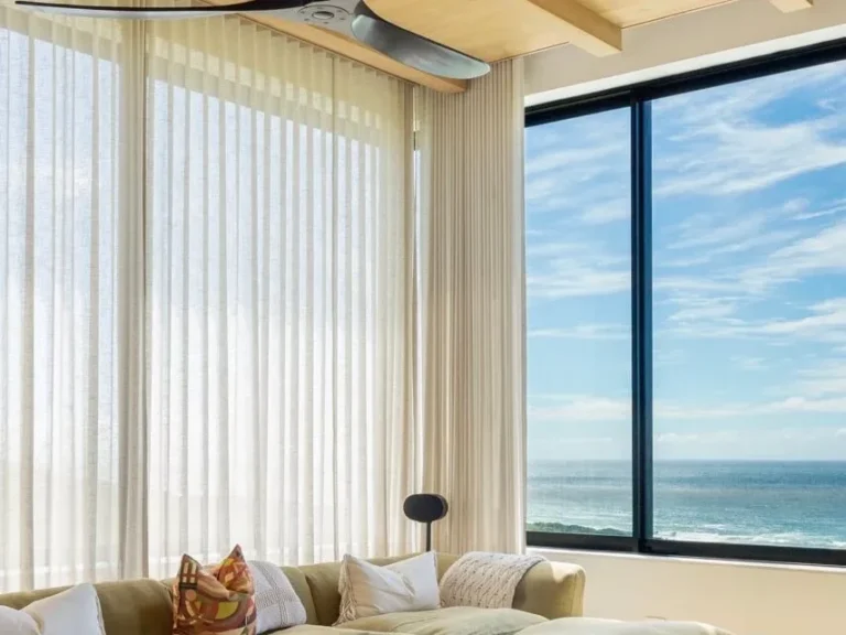 Sheer wave curtains in a sea-facing lounge