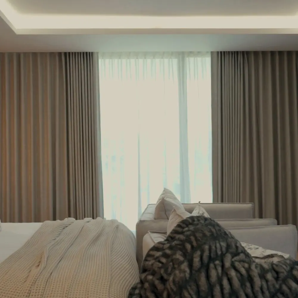 Motorised blackout and sheer curtains opening in a Ballito bedroom